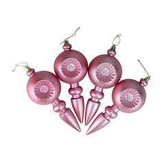 pink ornaments are arranged in the shape of balls and cones on a white background with clippings