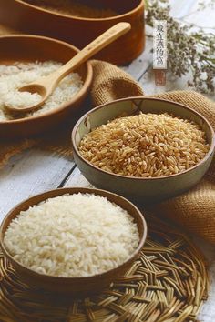 three bowls filled with rice on top of a wooden table