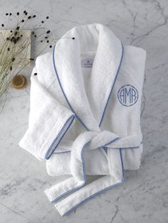 Matouk Robes. Cairo Terry Robe by Matouk. Signature Cairo long-staple cotton terry accented with piping in White or Ivory—to accentuate the tranquil ambience of a truly luxurious bath experience. Add a personal touch to the robe with an elegant monogram. Contact us for more information on Matouk Monogramming. You'll love Matouk Robes for all-year comfort. Terrycloth bath robe will keep you warm and cozy. Perfect addition to the luxury bath and Matouk bathrobes make a great gift. 100% Long-staple Custom Robes, Luxury Linens, Terry Robe, 자수 디자인, Towel Collection, Terry Towel, Bias Tape, Fine Linens, Luxury Linen