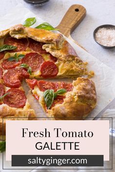 fresh tomato galette with basil leaves on top and text overlay that reads, fresh tomato galaette