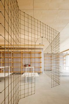 an empty room with wooden shelves and shelving