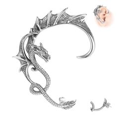 a silver bracelet with a dragon on the side and an earring attached to it