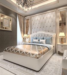 a large bed sitting in the middle of a bedroom next to a chandelier