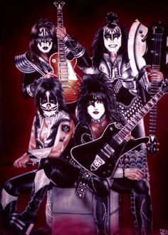 the band kiss posing for a photo with their guitars