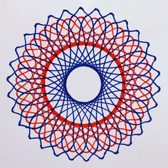 a blue and red circular design on a white surface with an orange circle in the center