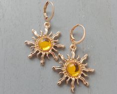 Handmade: womens earrings in golden sun Each pair of earrings is presented in a small gift pouch and would make a wonderful gift for someone special or just a nice treat for yourself. The circumference of these sun earrings for women is 26mm with the addition of your chosen ear wire. The gold sun colour earrings catch many different lights beautifully and look amazing in the sunshine. Casual or dressed up they will match many outfits and get you plenty of compliments! The ear wire choices are: h Cute Yellow Cheap Earrings, Sun Earrings, Drop Sun Earrings, Adjustable Drop Earrings With Sun Design, Summer Sun Design Dangle Earrings, Elegant Sun Design Drop Earrings, Sun Design Drop Earrings, Golden Sun, Gold Sun