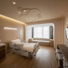 an empty hospital room with two beds in it