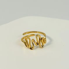 🌻This twisted curve ring features a unique, elegant design that effortlessly adds a touch of sophistication to any outfit. 🥰This piece is meticulously crafted from S925 sterling silver (total 2.6g) and finished with a luxurious coating of genuine 18k gold plating. 🥰This ring is adjustable to fit your desired size. 🥰We will send it in a beautiful jewelry box and package it carefully. We offer boxes in blue, green, white, and black. Please leave a message specifying your preferred color 🥰Plea Modern Twist Yellow Gold Bypass Ring, Gold Rings With A Modern Twist, Gold Bypass Ring With Modern Twist, Twisted Gold Ring For Gift, Elegant Gold Bypass Ring, Elegant Gold Open Bypass Ring, Elegant Gold Snake Ring With Open Design, Minimalist Twisted Gold Rings, Gold Midi Rings For Promise With Modern Twist