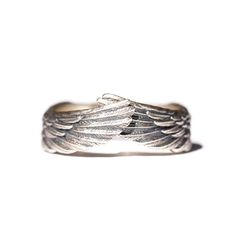 Embrace the ethereal grace with our Angel Wing Ring, a divine masterpiece that transcends the ordinary. Crafted with meticulous artistry, this ring is a harmonious fusion of celestial charm and timeless elegance. The angelic wings, delicately sculpted in sterling silver. Each feather is meticulously detailed, capturing the essence of celestial flight. The ring exudes a sense of otherworldly beauty as if the wearer has been touched by a celestial presence. This angel wings ring is adjustable and Wings Ring, Angel Wing Ring, Ring Party Jewelry, Angel Wings Design, Angel Ring, Feather Ring, Retro Punk, Animal Rings, Vintage Punk