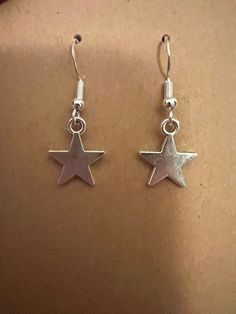 Small silver star earrings on silver hypoallergenic nickel free fishhook earrings. Star Earrings Silver, Quirky Accessories, Sterling Silver Star Earrings, Bumble Bee Earrings, Fishhook Earrings, Silver Star Earrings, Bee Earrings, Classy Jewelry, Fish Hook Earrings