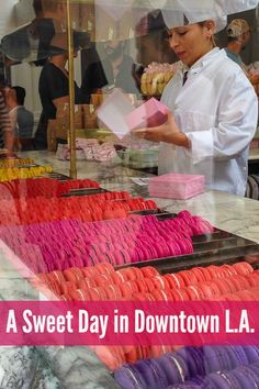 there is a woman that is standing in front of a store selling donuts and other items