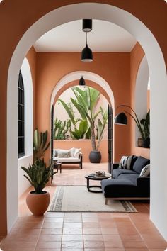 a living room with an archway leading to the outside