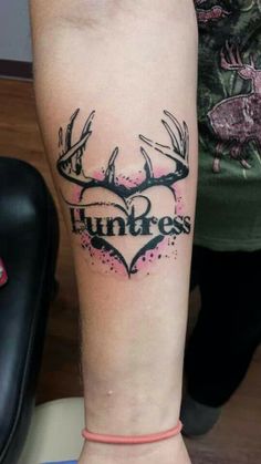 a tattoo on the leg of a woman with deer antlers and heart that says unfress