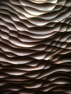 an abstract background with wavy lines in the shape of waves and shapes that appear to be made out of paper