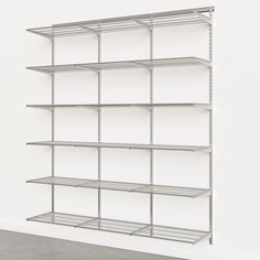 an empty shelving unit in a white room