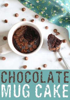 chocolate mug cake on a plate with a spoon and blue napkin in the background that says, chocolate mug cake