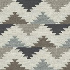 an area rug with different colors and patterns on it, including black, white, gray and