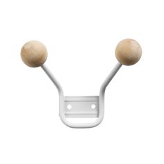 two wooden balls are attached to the back of a white wall hook on a white background