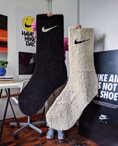 there are two pairs of nike socks on display