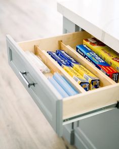 an open drawer with various items in it