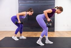 two women are doing exercises with kettles