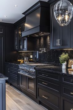 29 Black Modern Kitchen Ideas for a Bold and Sophisticated Look 21 Black Marble Countertops Kitchen, Dark Kitchen Aesthetic, Modern Dark Kitchen, Dark Kitchen Ideas, Farmhouse Kitchen Backsplash, Youtube Songs, Affordable Kitchen