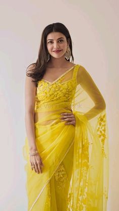 Are you worried that you’ll not get the right Haldi ceremony outfit to look like the perfect bride? Worry not. We are here to help you out. Scroll to the below list of some really amazing outfits that you can wear for your Haldi function. Yellow Sari, Orang India, Haldi Outfits, Kajal Agarwal, Saree Designs Party Wear, Indian Bridal Dress, Manish Malhotra