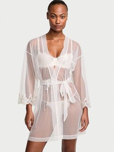 Our new floral embroidery is combined with light-as-air, sheer mesh to create this flirty, wrap-front robe. Tie waist belt Hits above knee Machine wash Imported White Mesh Robe, White Delicate Lace Robe, Victoria's Secret Sheer Summer Sleepwear, Fitted Lace Robe With Sheer Details, White Beach Cover-up Dress With Floral Embroidery, Womens Robe, Lingerie Catalog, Women's Robe, Womens Robes