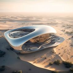 a futuristic building in the middle of sand dunes