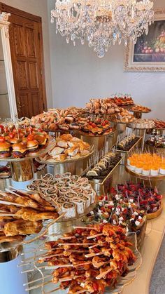 a buffet table filled with lots of food