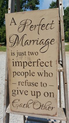 a sign that says a perfect marriage is just two imperfect people who refuse to give up on each other