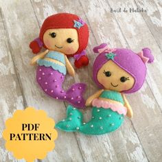 two little mermaid dolls sitting next to each other on a wooden floor with text overlay