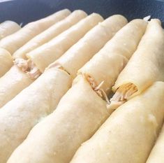 some food that is in a pan on the stove and ready to be cooked into something