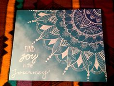 a card with the words find joy in the journey on it sitting on a blanket