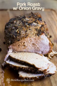 pork roast with onion gravy on a cutting board