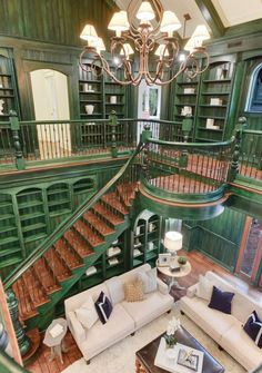 a living room filled with furniture and a spiral staircase