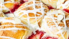 a close up view of some croissants covered in icing