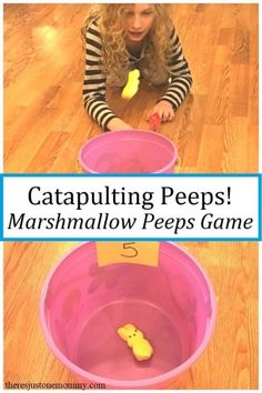 a girl is playing with her toys in the water and catapulting peps marshmallow peeps game