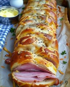 a ham and cheese bread is on a tray