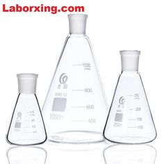 three flasks with labels on them are shown in front of a white background