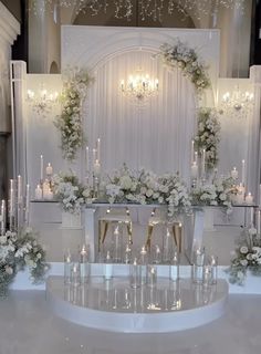 an elegant wedding setup with candles and flowers