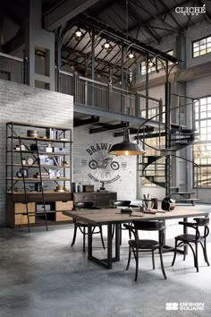 an industrial style dining room with stairs and tables