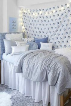 a bed with white sheets and pillows in a room decorated for christmas or new year's eve