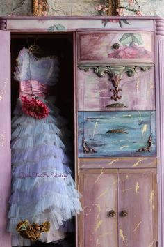 a dress that is sitting on top of a cabinet