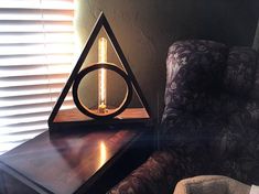 a harry potter deathly hall lamp on a table