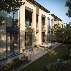 an artist's rendering of a modern house with patio and dining table in the foreground