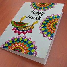 a birthday card with an artistic design on the front and back cover that says happy diwali