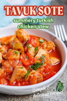 a white bowl filled with chicken stew next to a fork