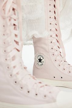 Find CONVERSE Chuck Taylor All Star Xx-hi Ruffles & Bows Sneakers on Editorialist. An edgy style goes full femme with these knee-high Converse sneakers, featured in their signature silhouette with a bold tall shaft, adorned with ribbons and ruffles for a darling touch. **Features:** Knee-high length, soft textile uppers, rubber toe cap, ruffle trim, ribbon laces, back zipper, OrthoLite footbed, durable rubber outsole, signature diamond tread **Why We ❤ It:** Takes balletcore to whole new level. Converse Floral, Knee High Converse, High Converse, Ribbon Laces, Converse Pink, High Top Converse, Bow Sneakers, Converse Sneakers, Edgy Style