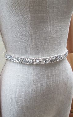 "This sparkly belt is made with the Premium Quality European Crystals appliqued on a 5/8\" wide double face satin ribbon. The length of the beading can be specified, please choose the length from the drop down menu during checkout. Available in gold or silver finish. - For the photo of the satin ribbon color options please take a look here: https://www.etsy.com/listing/225025505/satin-ribbon-swatches-ribbon-color?click_key=940a448d5b9f155300a35808a7a0ba11b9d03365%3A225025505&click_sum=d2690937&r Bride Belt, Sparkly Belt, Sparkly Belts, Wedding Belt, Wedding Dress Belt, Sparkly Wedding, Wedding Sash Belt, Sparkle Wedding, Rhinestone Belt